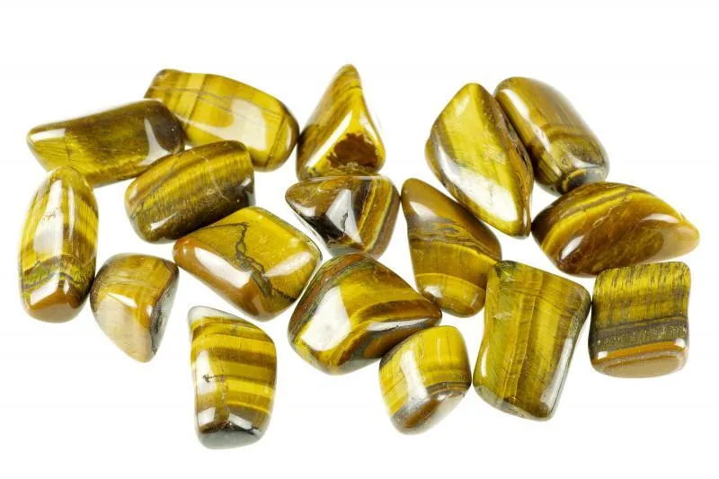 A pile of polished tiger's-eye tumbled stones